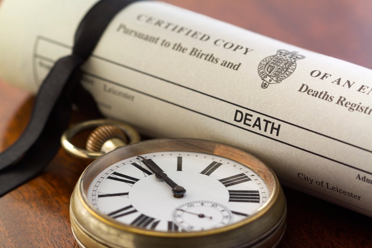 Death Certificate and Pocket Watch at Midnight